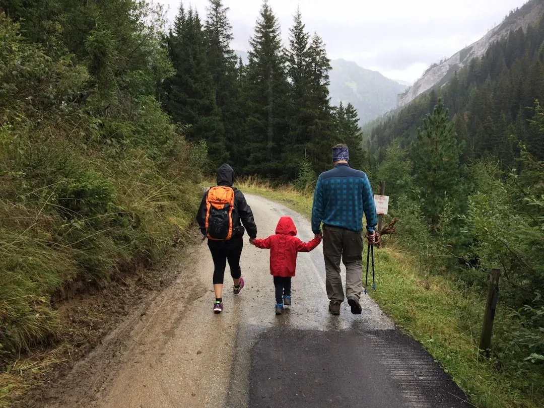 family hiking group walking together on a scenic trail