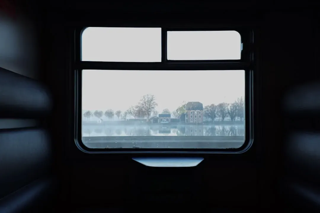 scenic train window view of mountains and valleys